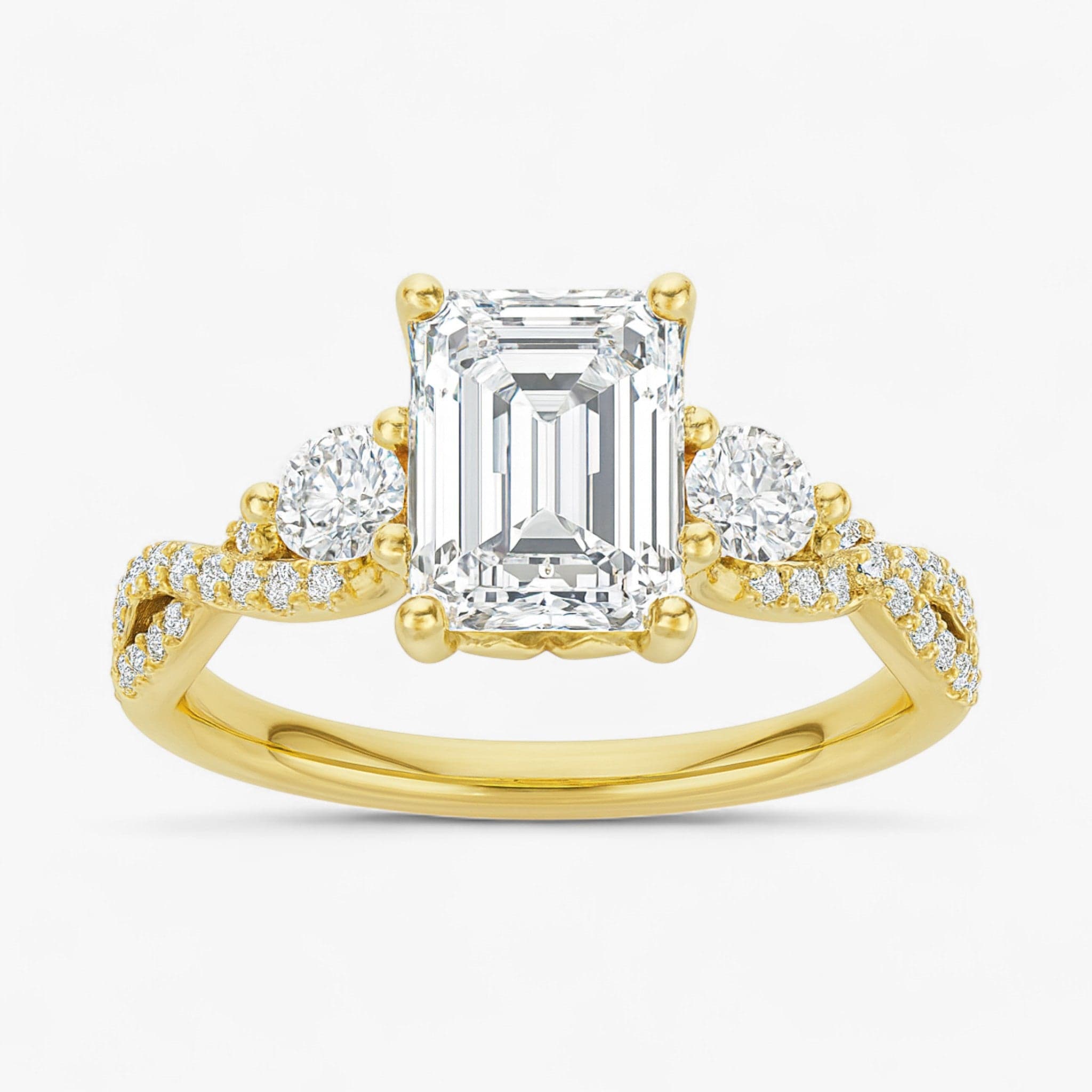 The Iconic 3-Stone Twisted Engagement Ring | Emerald