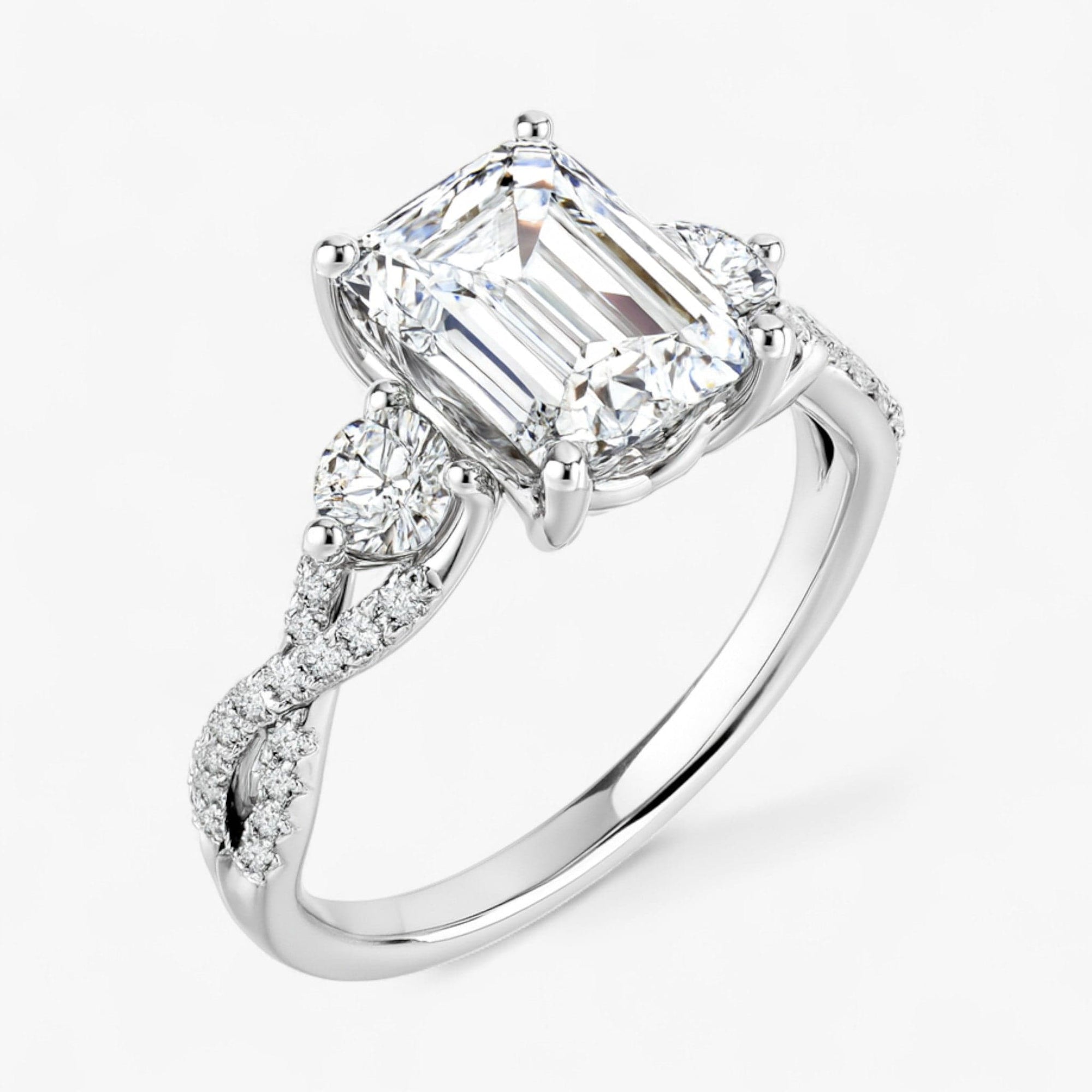 The Iconic 3-Stone Twisted Engagement Ring | Emerald