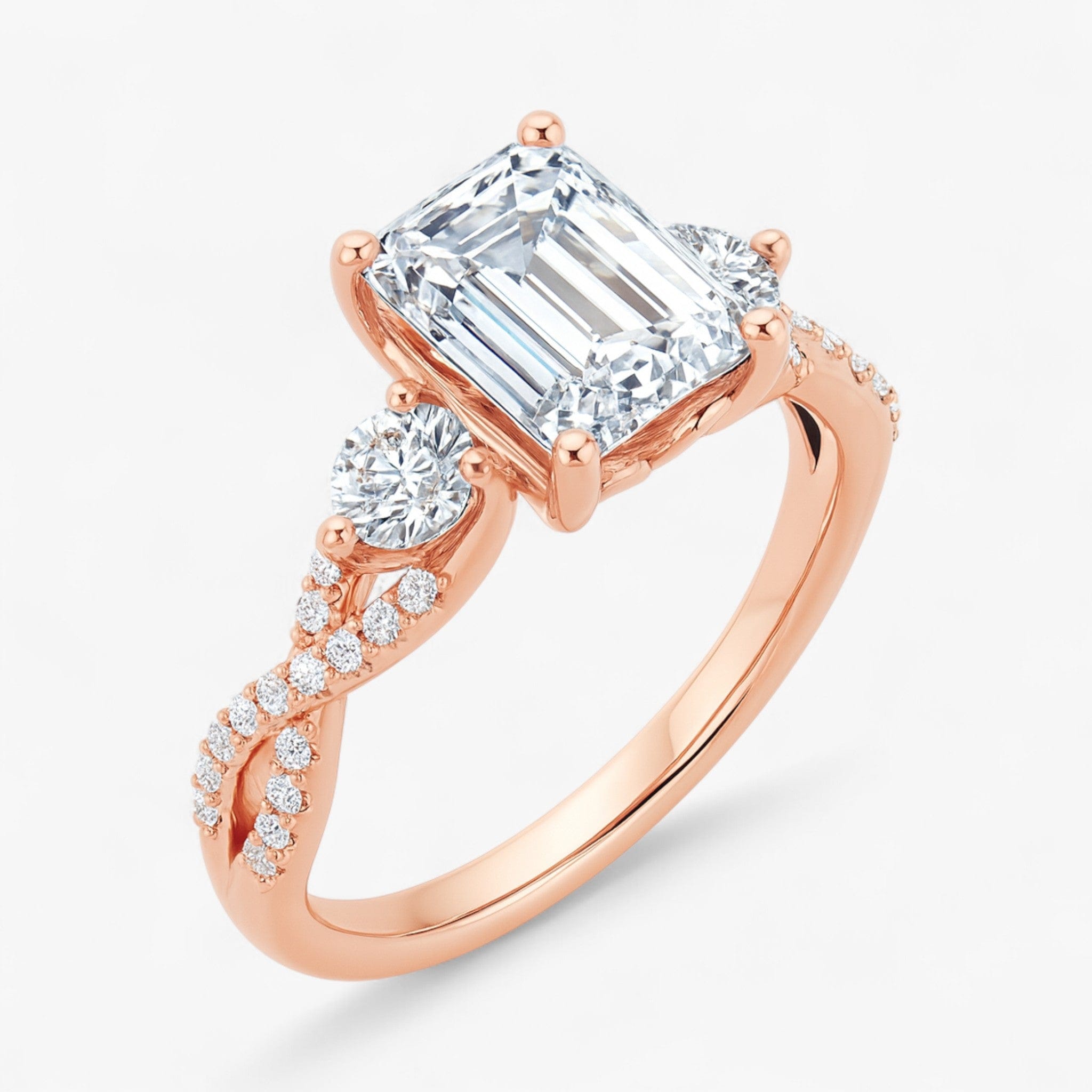 The Iconic 3-Stone Twisted Engagement Ring | Emerald