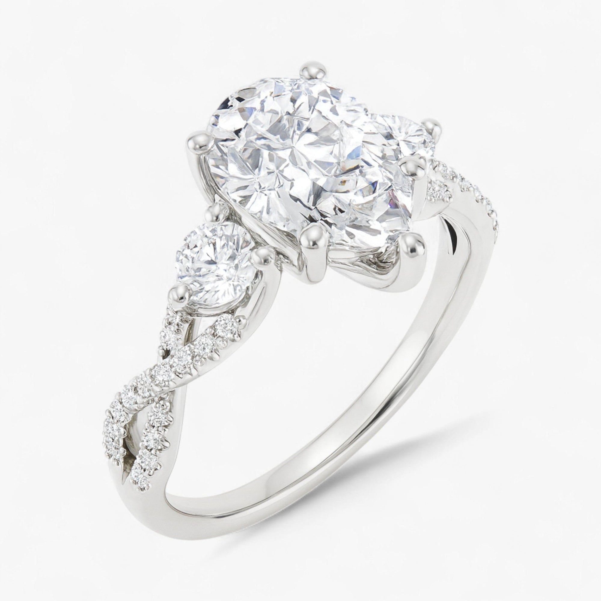 The Iconic 3-Stone Twisted Engagement Ring | Pear