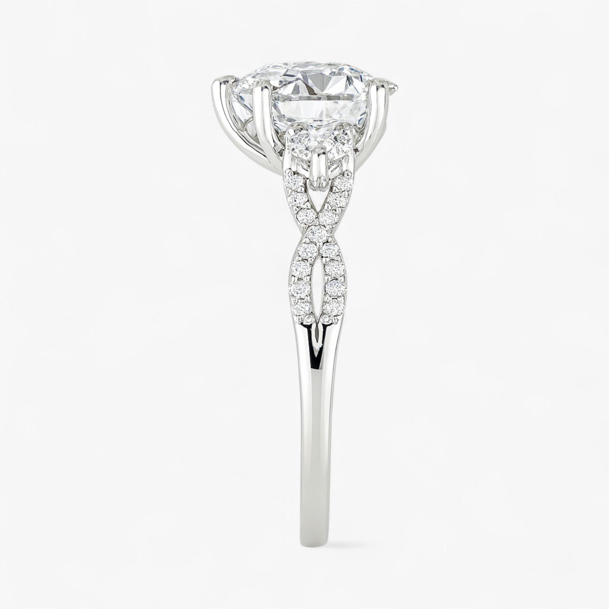 The Iconic 3-Stone Twisted Engagement Ring | Pear