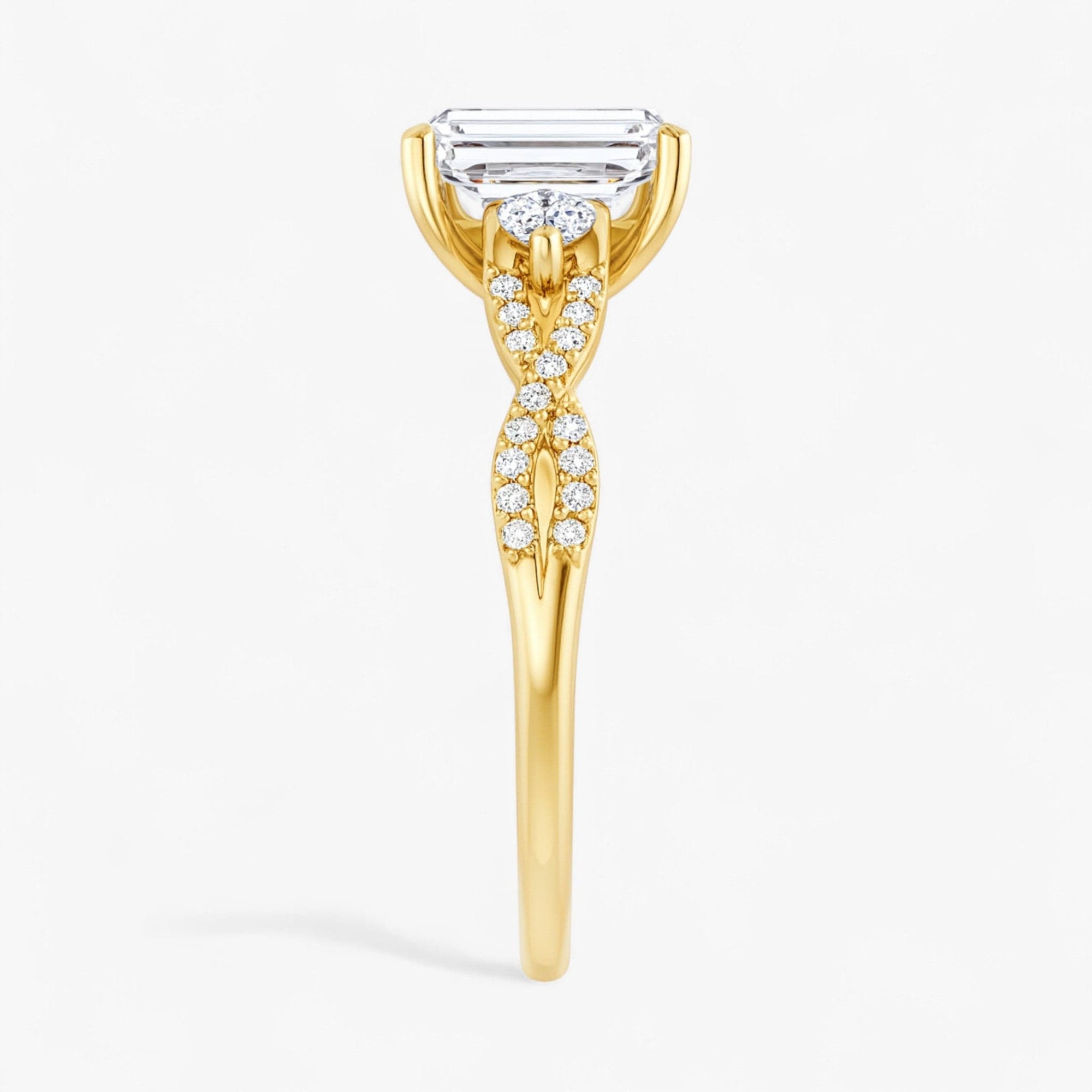 The Iconic 3-Stone Twisted Engagement Ring | Emerald