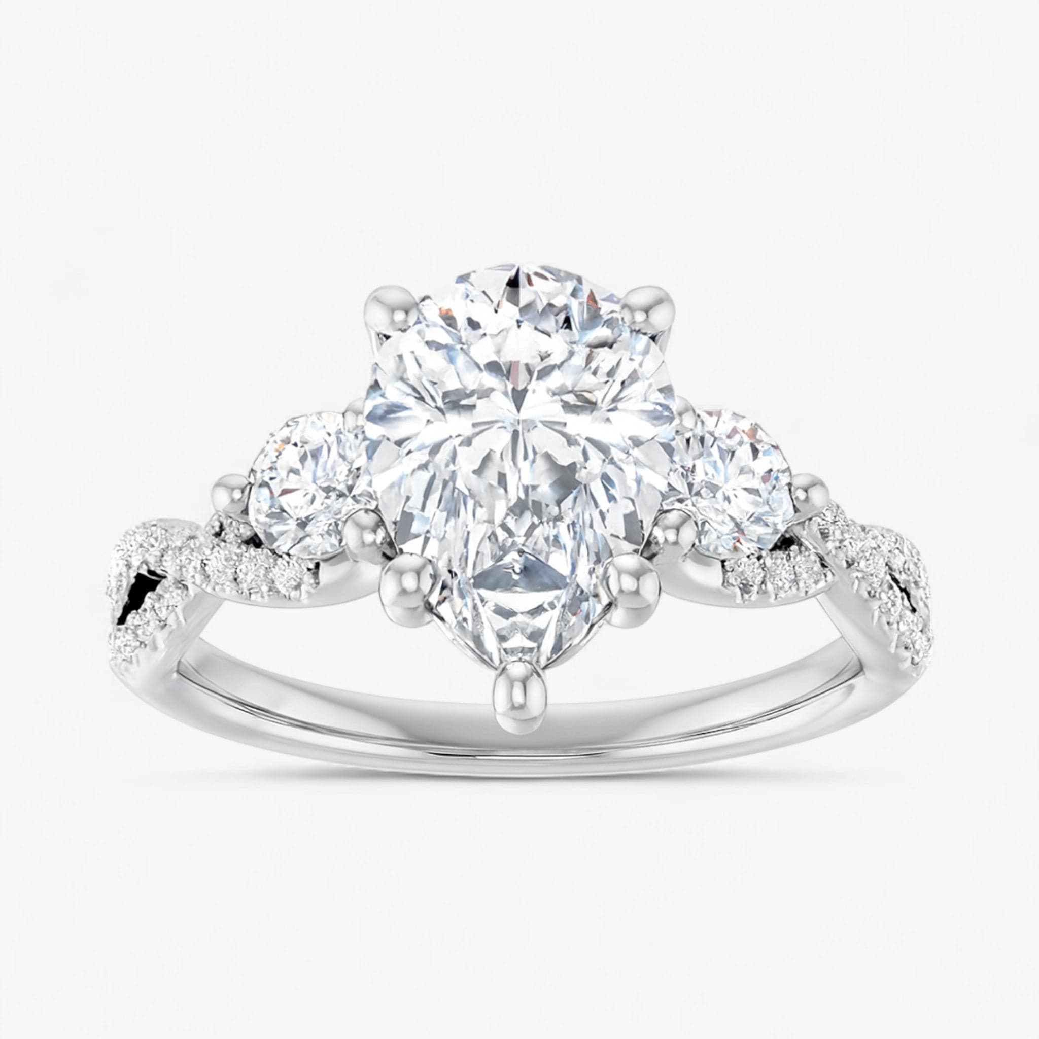 The Iconic 3-Stone Twisted Engagement Ring | Pear
